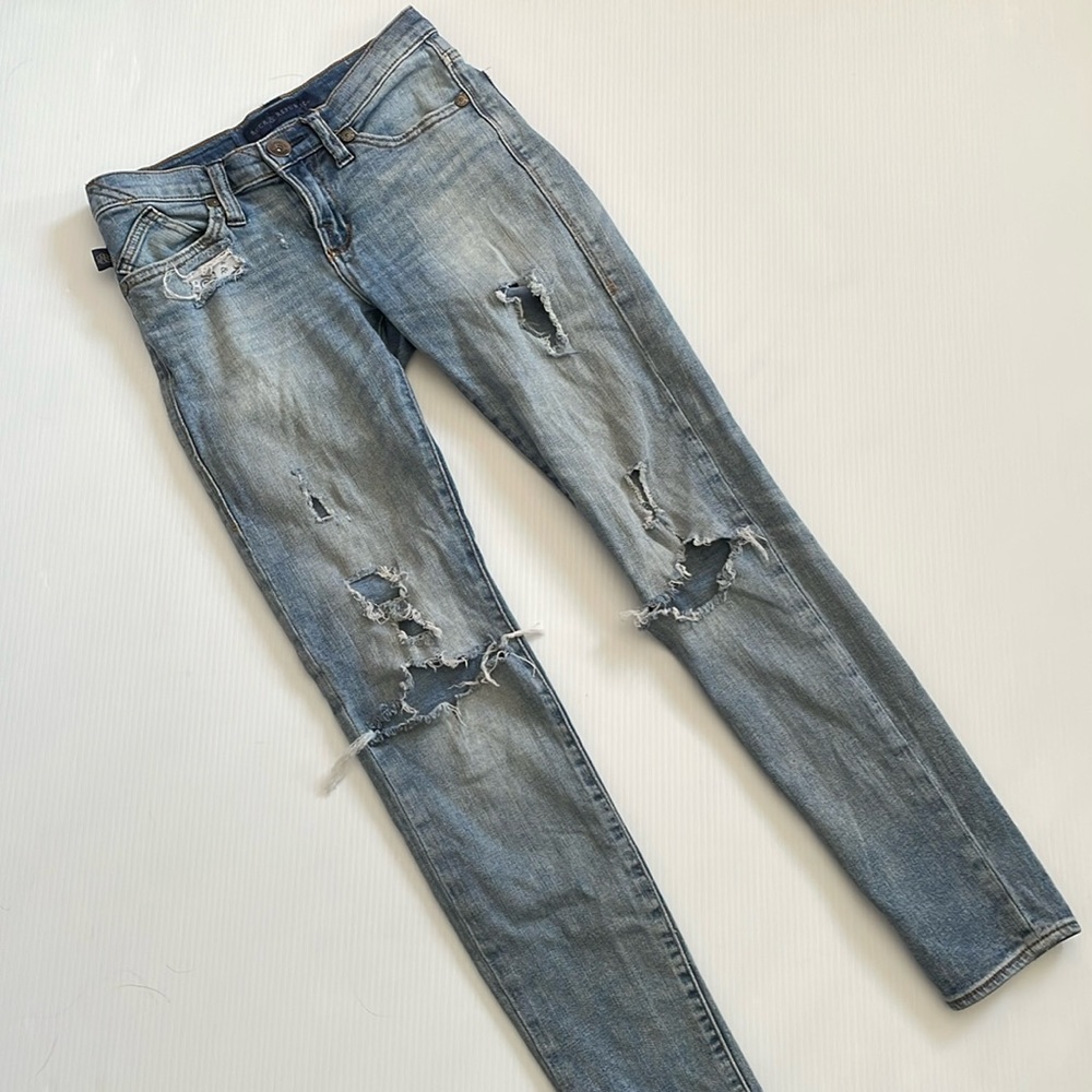 Rock & Republic super distressed, faded blue jeans with holes. Women’s size 2